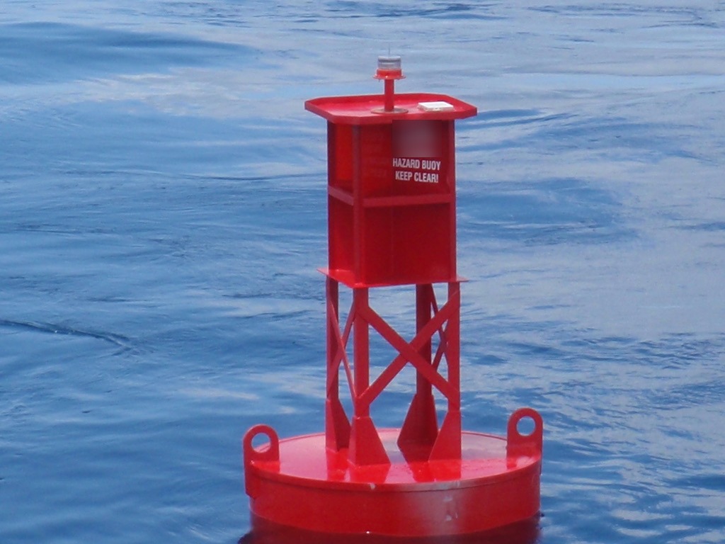 Red BL 620 steel buoy, the 6 x 20 620 buoy, with LED lantern, welded tower and built-in radar reflector on station offshore