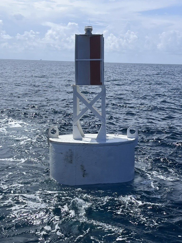 White BL 620 steel buoy with welded tower, built-in radar reflector, lantern and mooring eyes on station offshore, built by Wet Tech Energy in Maurice, Louisiana